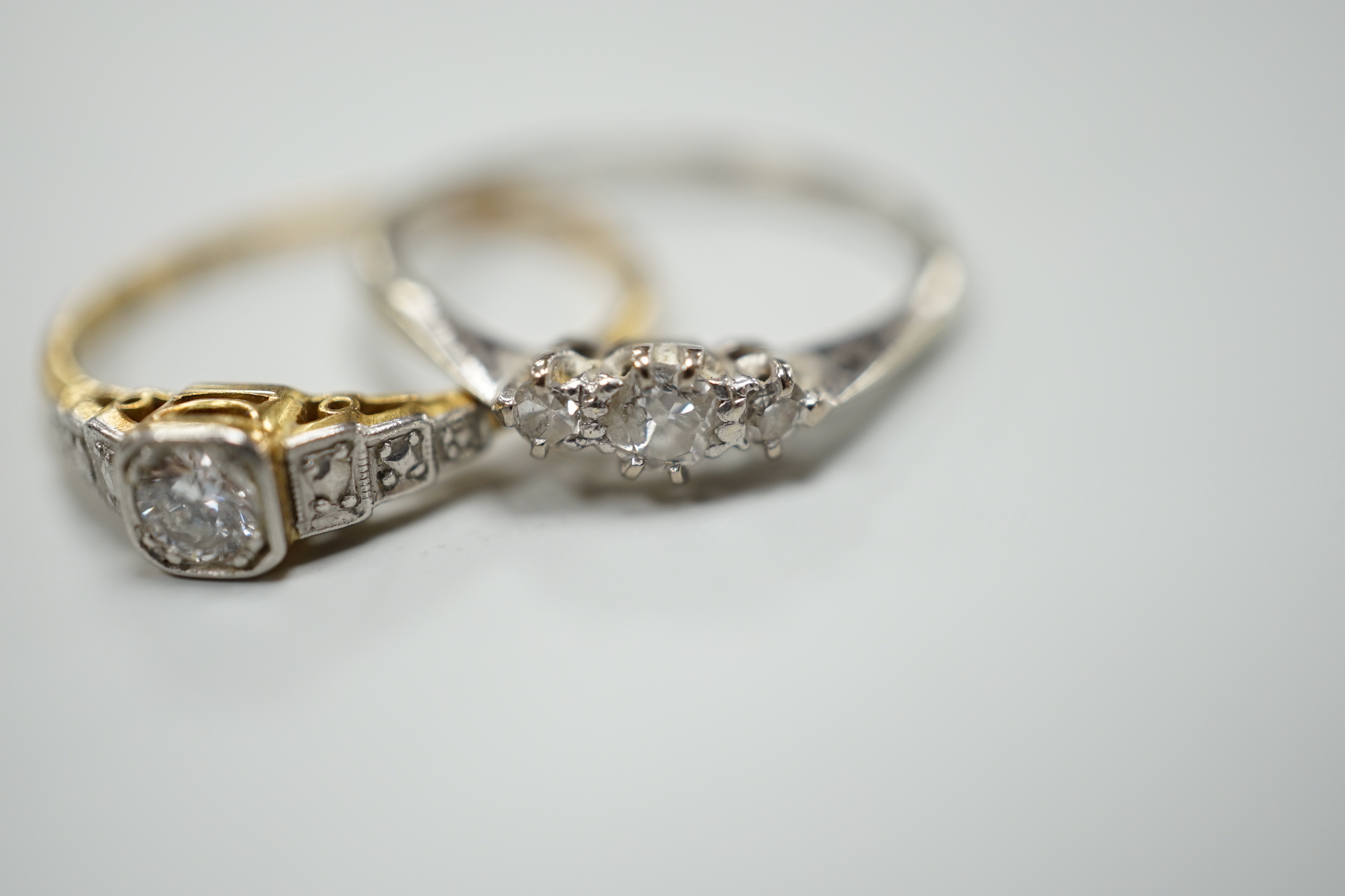 Two 18ct,plat and diamond set rings including single stone, size Q and three stone, size O/P, gross weight 4.3 grams.